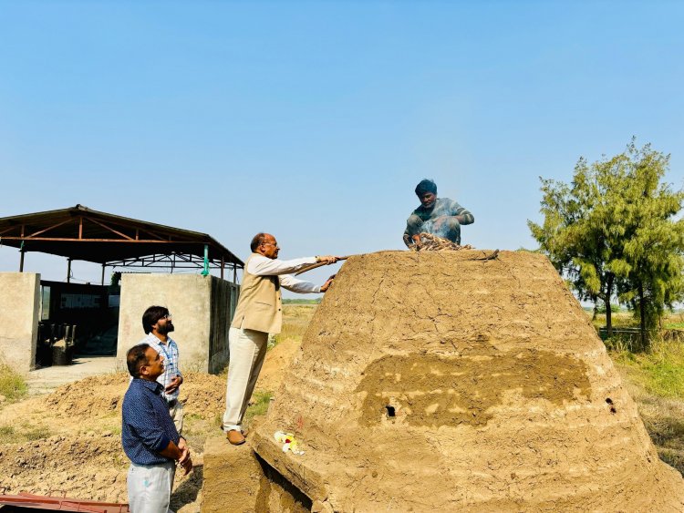 Hon'ble Vice-Chancellor Dr. Z. P. Patel along with Dr. V. R. Naik, ADR and Dr. J. M. Patel, Research Scientist, SWMRU inaugurated and lit fire to set on functioning the indigenous low cost, high efficient wood and organic matter pyrolysis Kiln to produce carbon rich stable Biochar from the ‘Prosopis juliflora’ wood at Coastal Soil Salinity Research Station, Danti on January 17, 2024